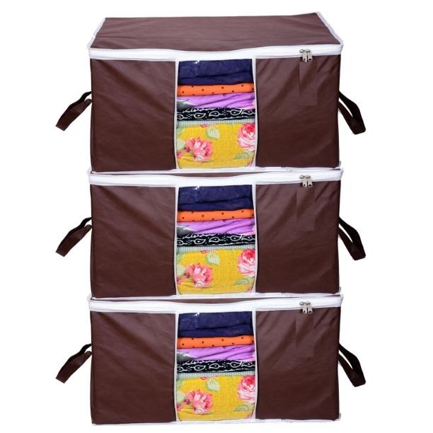 Set of three brown fabric storage bags with zippers and clear windows showing folded colorful clothes inside